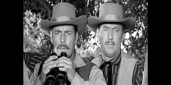 Buster Crabbe as Wyatt Earp and Gregory Walcott as Bat Masterson, arriving to help Pat Garrett deal with his outlaw problem in Badman's Country (1958)