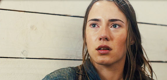 Caren Pistorius as Rose Ross, a young girl who fled Europe for the American West with a price on her head in Slow West (2015)