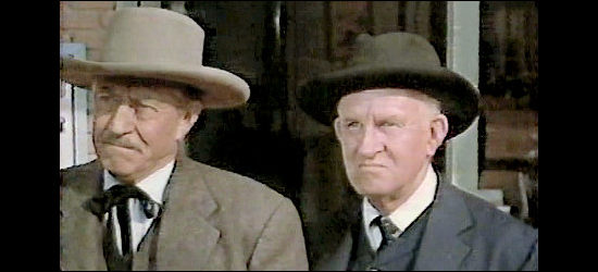 Carl Benton Reid as Judge McLean (left) and a fellow townsman want Jagade run out of West End in A Day of Fury (1956)