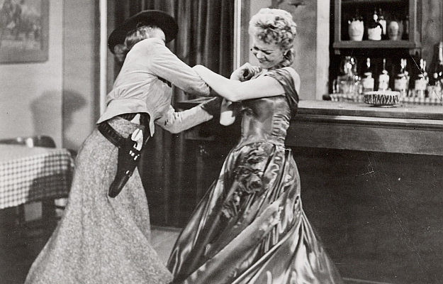 Cathy Downs as Susan Grant and Peggie Castle as Maria 'Oklahoma' Saunders decide the time for talking is over in The Oklahoma Woman (1956)