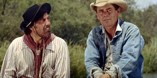 Cesar Romero as Manuel Silvera and Glenn Ford as Sam Dent searching for a guilty man in The Americano (1955)