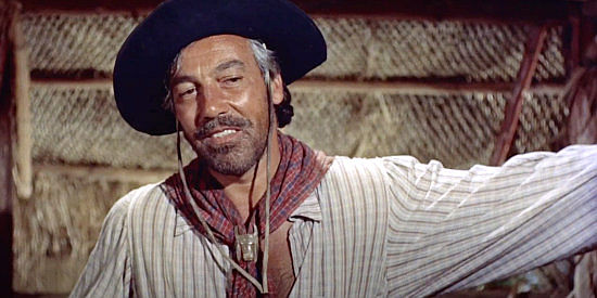 Cesar Romero as Manuel Silvera, trying to convince Sam Dent that Hermany isn't what he seems in The Americano (1955)