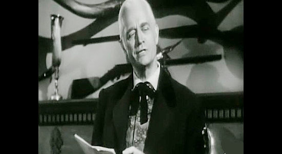 Charles Trowbridge as Justin Stone, reviewing the debt he's owed by the owner of the newspaper in The Bushwhackers (1952)