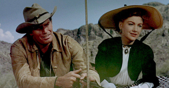 Charlton Heston as Colt Saunders, taking Lorna (Anne Baxter) home to the Bar S ranch in Three Violent People (1957)