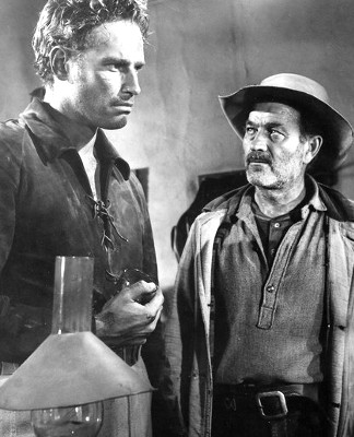 Charlton Heston as Ed Bannon and Milburn Stone as Sandy MacKinnon in Arrowhead (1953)