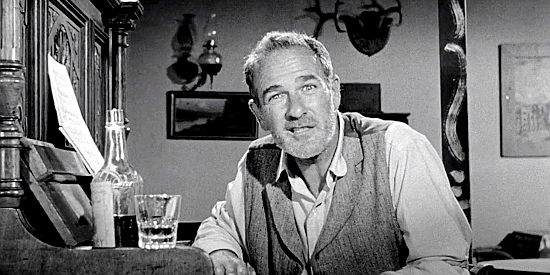 Chick Chandler as Shakey Wilson, the narrator of the story about how the Salazar Curse came to the small town of Topaz in Naked Gun (1956)