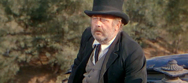 Chubby Johnson as Denver Calhoun, the undertaker who travels with the Johnsons in Law and Order (1953)