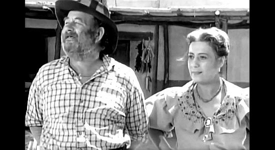 Chubby Johnson as Juke and Argentina Brunetti as Madre, watching a stage approach in Apache War Smoke (1952)
