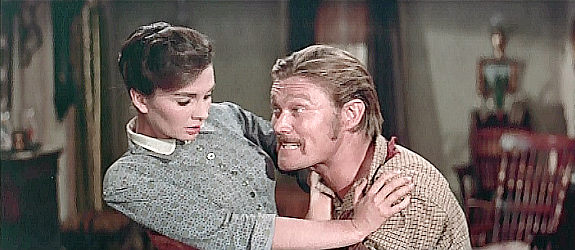 Chuck Connors as Buck Hannassey, trying to win over Julie Maragon (Jean Simmons) in The Big Country (1958)