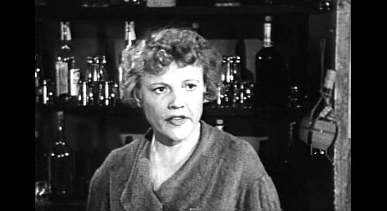 Claire Carleton as Minn, owner of a watering hole outlaws like visiting in A Lust to Kill (1958)