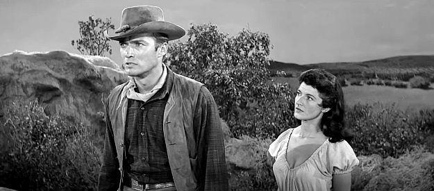 Clint Eastwood as Keith Williams with Margia Dean as Teresa Santos in Ambush at Cimarron Pass (1958)