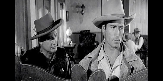Clint Walker as Gar Davis, on the hunt for a man in Largo in spite of a warning from the sheriff (Russ Conway) in Fort Dobbs (1958)