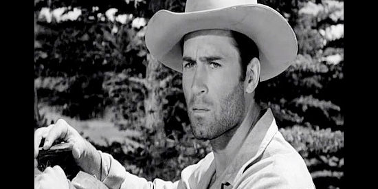 Clint Walker as Gar Davis, trying to lead Celia Gray and her son to safety though she suspects him of killing her husband in Fort Dobbs (1958)