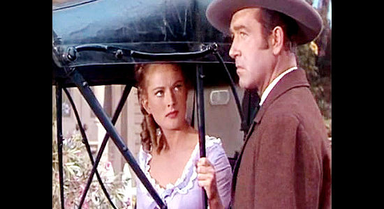 Coleen Gray as Jane Colfax, trying to figure out why old friend Rockwell Grayson (John Payne) is working with Roger Hale in The Vanquished (1953)