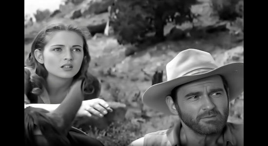 Coleen Gray as Nora Haynes and Jeff Morrow as Hack Williams, spotting an Apache ambush in Copper Sky (1957)