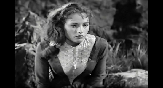Coleen Gray as Nora Haynes, reacing to narrowing escaping the grasp of an Apache warrior in Copper Sky (1957)