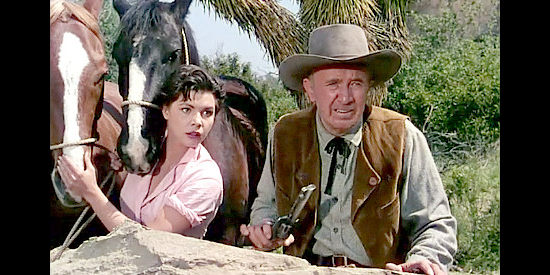 Colleen Miller as Lolly Bhumer and Walter Brennan as her dad George, on the watch for Indians in Four Guns to the Border (1954)