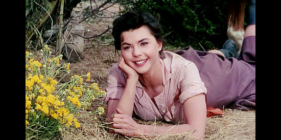 Colleen Miller as Lolly Bhumer. a young woman who doesn't always act like a lady in Four Guns to the Border (1954)