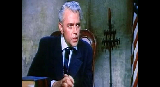 Dan O'Herlihy as Judge Millard Isham, giving the jury instructions as deliberations begin in The Young Land (1959)