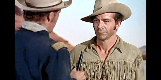 Dana Andrews as Brett Halliday, trying to save a cavalry patrol led by a man who wants to see him dead in Smoke Signal (1955)