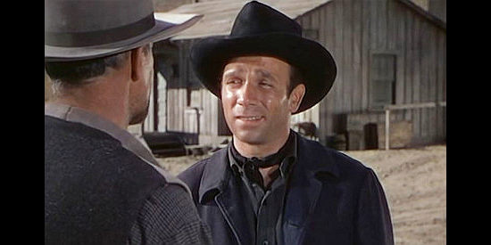 Dane Clark as Bob Peters, having his first disagreement with Kruger in Barricade (1950)