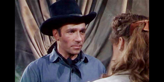 Dane Clark as Bob Peters, trying to figure out a future with a woman who escaped prison in Barricade (1950)