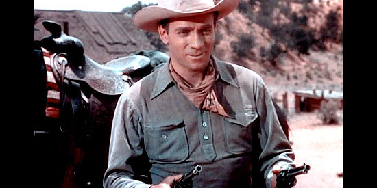 Dane Clark as Johnny Tallon, showing why he's so feared with a six-gun in his hand in Fort Defiance (1951)