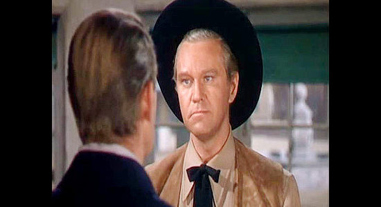 David Brian as Blair Lunsford, realizing he and Ned Britt no longer see eye to eye in Fort Worth (1951)