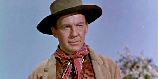 David Wayne as Tracy Powell, a man stricken by gold fever in The Naked Hills (1956)