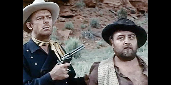 Dennis O'Keefe as Capt. Matt Riordan, threatening the life of Jonah (Sebastian Cabot) in Dragoon Wells Massacre (1957)