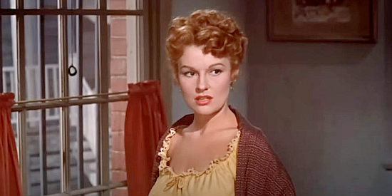 Dianne Foster as Chris Palmer, the saloon owner who can't get over her feelings for Jim Guthrie in Three Hours to Kill (1954)