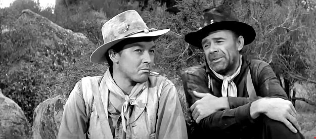 Dirk London as Johnny Willows and one of Sgt. Blake's men discuss their plight in Ambush at Cimarron Pass (1958)