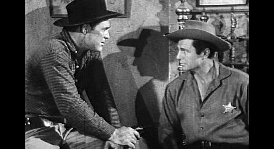 Don Megowan as Cheney Hollnad, turning the tables by handcuffing Marshal Matt Gordon (Jim Davis) in A Lust to Kill (1958)