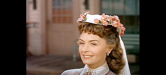 Donna Reed as Laurie MacKaye, arriving at Fort McCullough to a host of admirers in They Rode West (1954)
