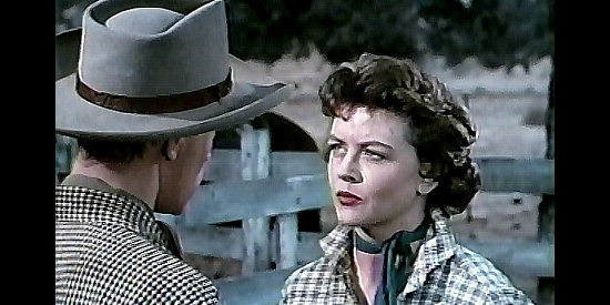 Dorothy Malone as Charlotte Downing, learning from her brother that there's rustled cattle on their land in The Lone Gun (1954)