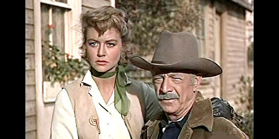 Dorothy Malone as Corinna Ordway with her father Tuck (Robert Barrat), chased from their home based on information uncovered by Madden's attorney in Tall Man Riding (1955)