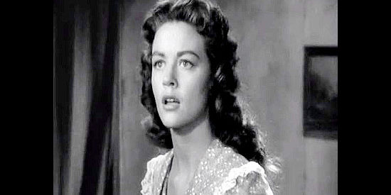 Dorothy Malone as Julie Ann Winslow, learning who Wes McQueen really is in Colorado Territory (1949)