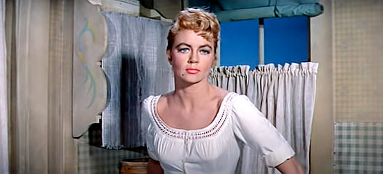 Dorothy Malone as Lily Dollar, worried about Johnny Gannon in Warlock (1959)