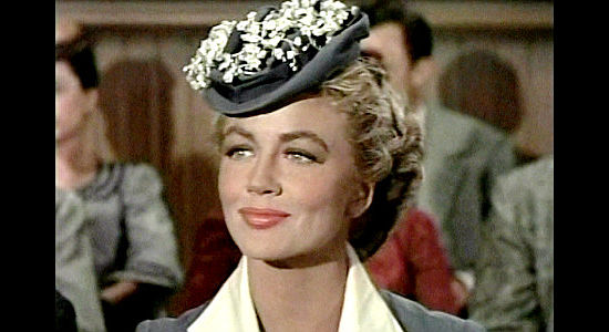 Dorothy Malone as Lorna Miller, pleased to see her husband take a stand against the cattlemen in court in Tension at Table Rock (1956)
