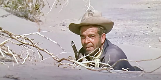 Douglas Kennedy as Trooper Clancy, pinned down by Indians in War Paint (1953)