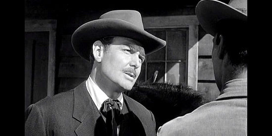 Ed Hinton as Detective Hiram Parsh, a man on the trail of the female bandits in The Dalton Girls (1957)
