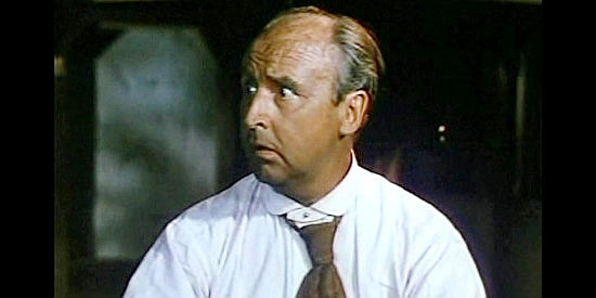 Eddie Parks as Rufus Black, the coffin salesman robbed in the stagecoach holdup in Slaughter Trail (1951)
