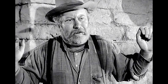 Edgar Buchanan as Sam Todd, under the gun of outlaw Rafe Zimmerman in Rawhide (1951)