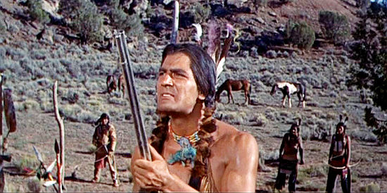 Edmund Hashim as Iron Wolf, the Indian chief who winds up in possession of 800 repeating rifles in Quincannon, Frontier Scout (1956)