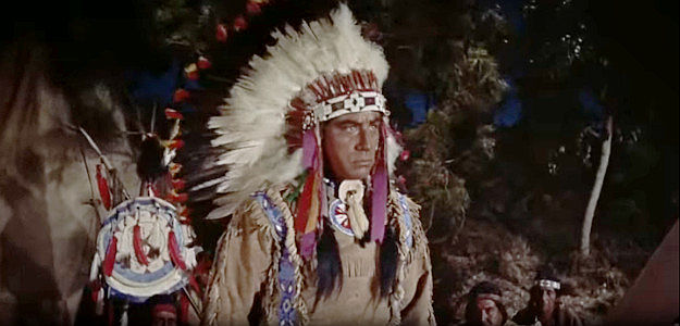 Eduardo Noriega as Shoshone Chief Cameahwait, Sacajawea's brother, pledging his friendship with the white explorers in The Far Horizons (1955)