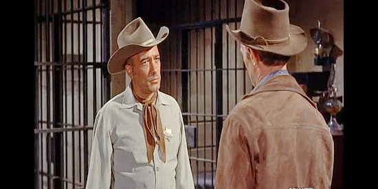 Edward Platt as Sheriff J.C. Martin, urging Jim Slater to leave Silver City as soon as possible in Backlash (1956)