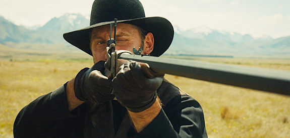 Edwin Wright as Victor the Hawk, one of the bounty killers on the trail of John and Rose Ross in Slow West (2015)