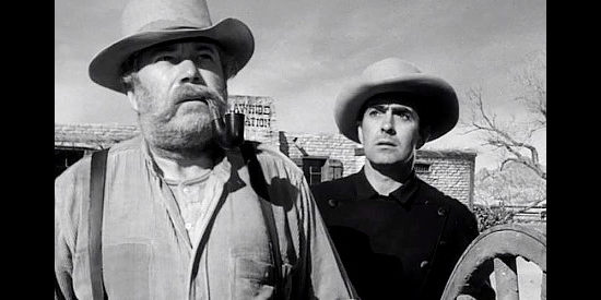 Edgar Buchanan as Sam Todd and Tyrone Power as Tom Owens, watching a mysterious rider approach in Rawhide (1951)