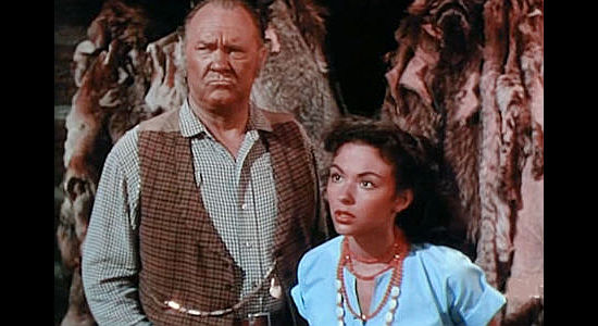 Emory Parnell as Patrick Fitzbibbon and Rita Moreno as his daughter Bridget, being questioned about stolen furs in Fort Vengeance (1953)