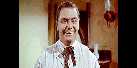 Ernest Borgnine as Bill Rachin, the hotel worker who arouses Jim Kipp's suspicion in The Bounty Hunter (1954)